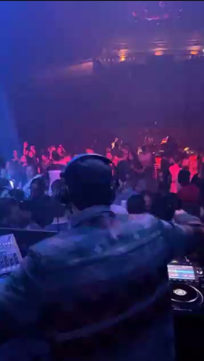 Packed club room from the booth