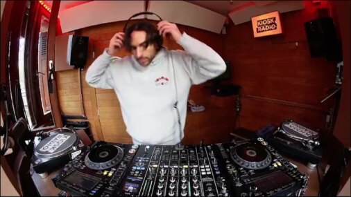 M.O.S adjusting headphones in the Kiosk Radio booth